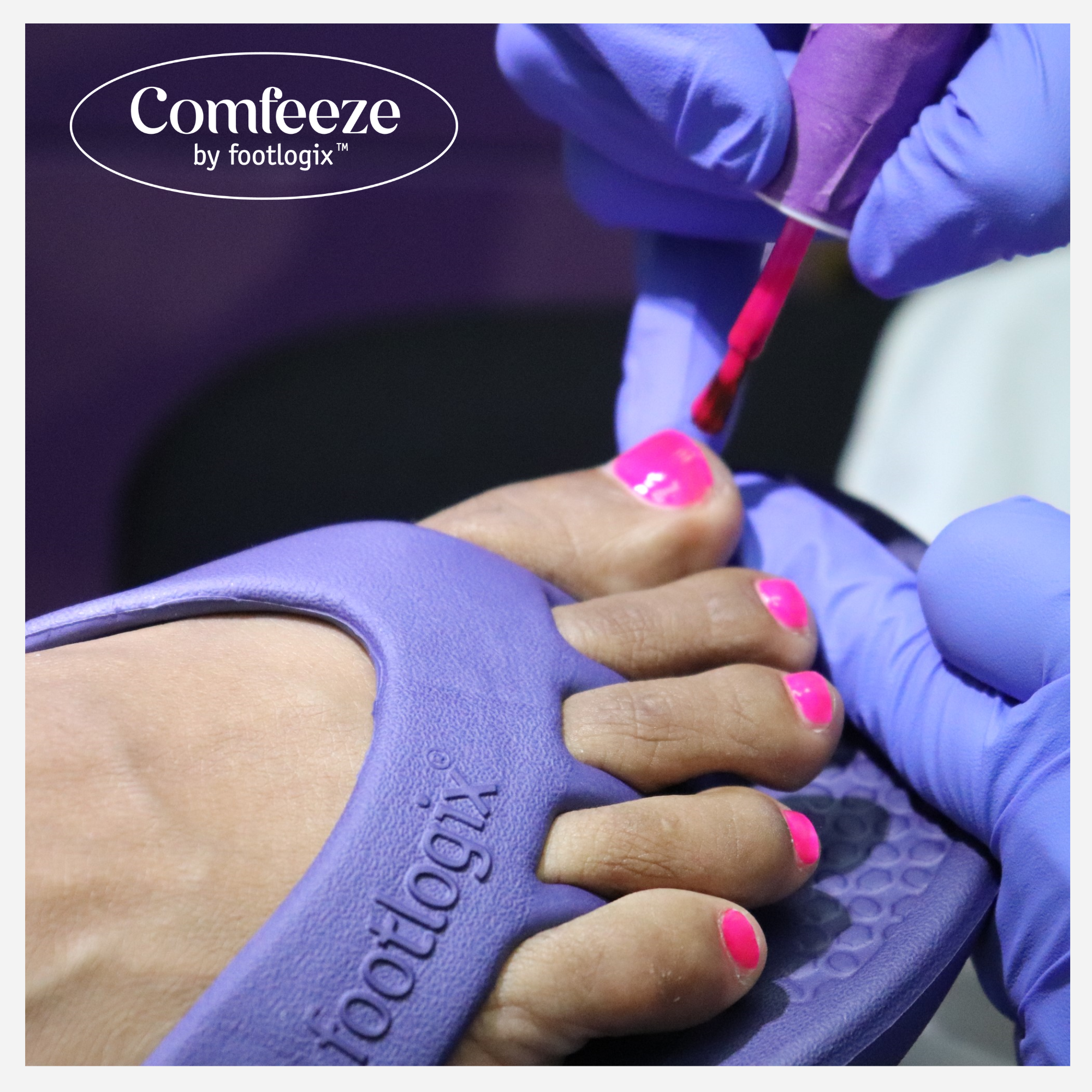 Close-up of feet in purple Comfeeze by Footlogix™ sandals during a pedicure, with vibrant pink polish being applied by a gloved technician.