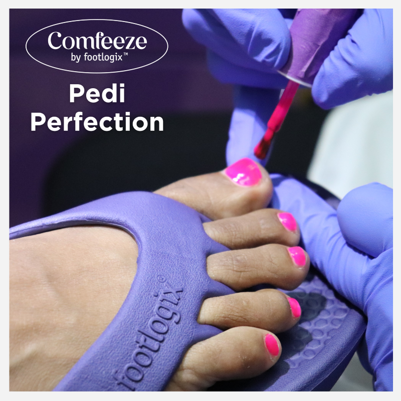 Close up of a woman wearing Comfeeze by Footlogix sandals while getting nail polish applied as part of a pedicure.  The caption on the photo suggests that Comfeeze by Footlogix are the ideal sandals for a pedicure offering optimal toe-separation and giving you the ability to apply polish and go