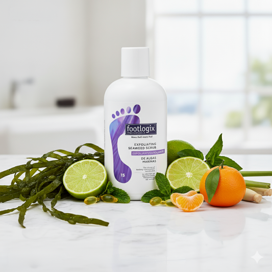Footlogix scrub bottle with lime, orange, and seaweed on a white surface